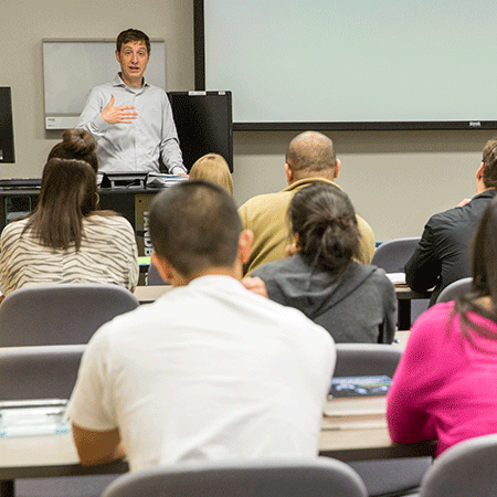 instructor teaching Instructor Teaching in front of class