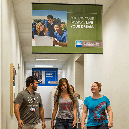 students walking  students walking in hallway